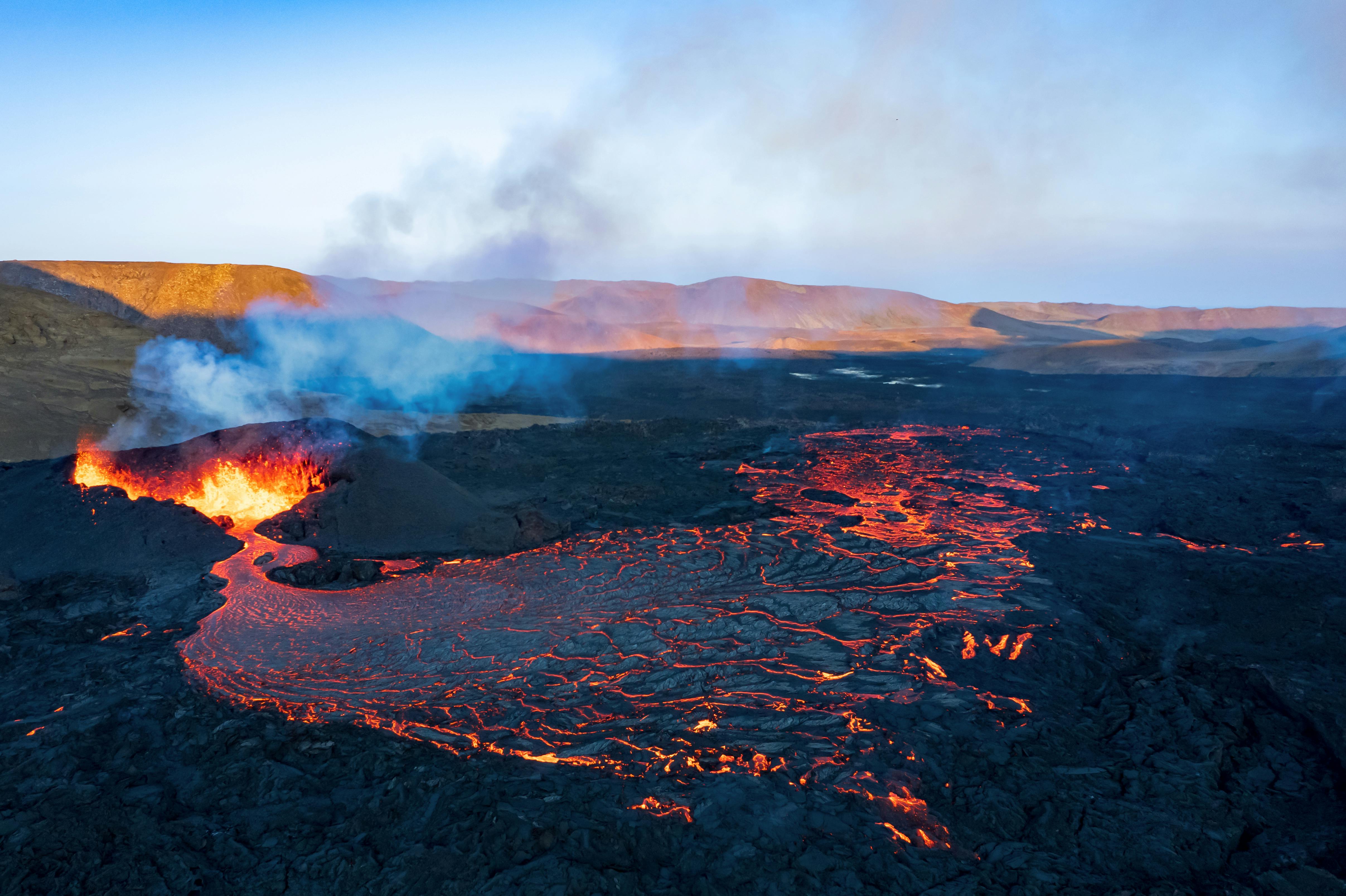 A waterfall and geothermal landscape in Iceland